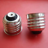 Copper nickel E27 lamp-base lampholder D090 on red background